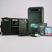 Nikon Coolpix S1000pj 12.1MP CCD Compact Projector Digital Camera