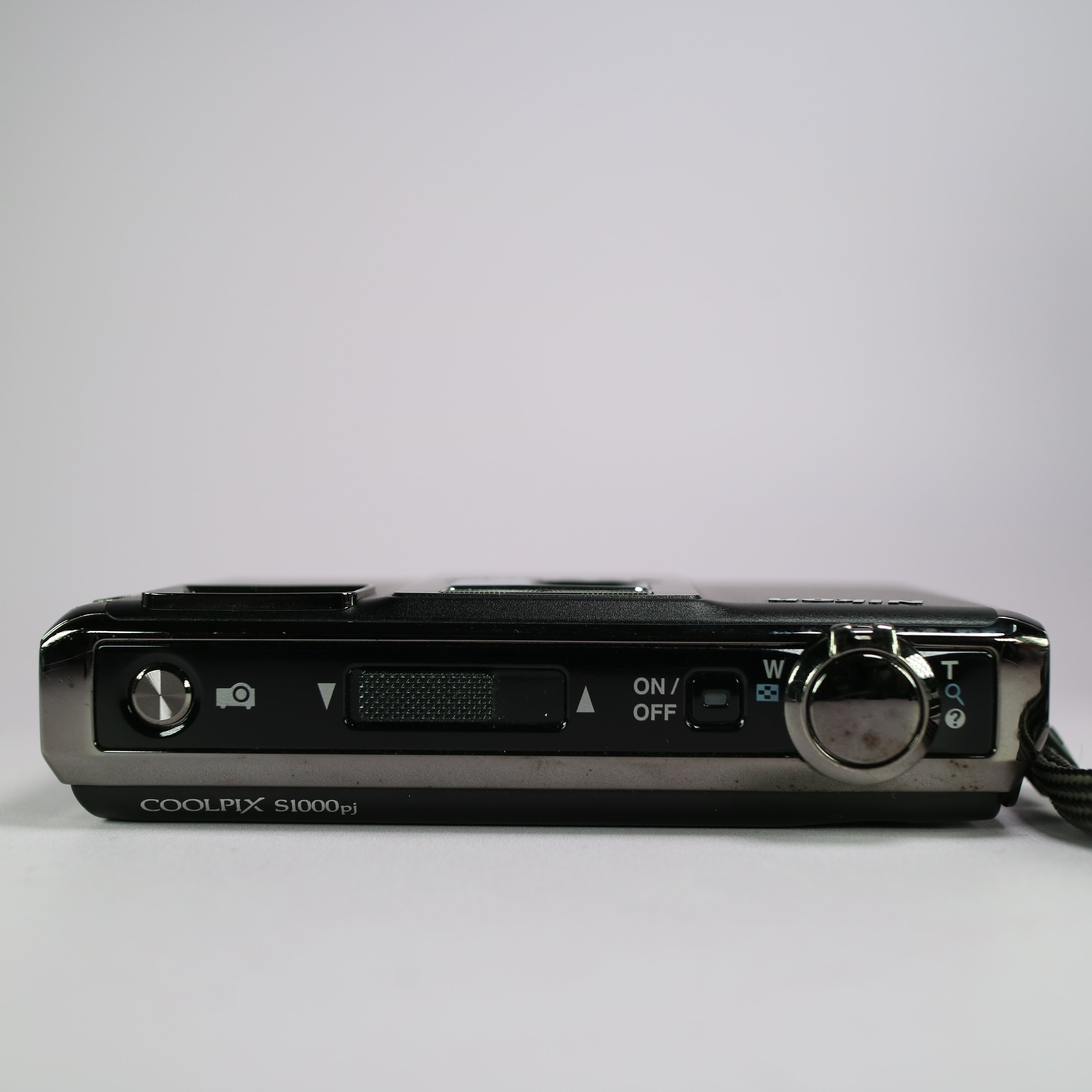 Nikon Coolpix S1000pj 12.1MP CCD Compact Projector Digital Camera